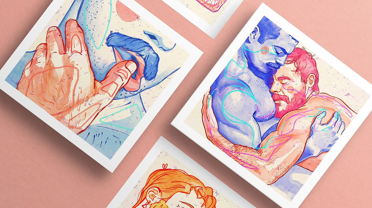 Colorful gay art prints showing tender moments between men, arranged on a soft pink background.